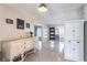 Inviting living room with a decorative dresser, welcome home decor, and beautiful terrazzo flooring at 1361 Hobson St, Longwood, FL 32750