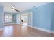 Bright living room with french doors, and a large ceiling fan at 1361 Hobson St, Longwood, FL 32750