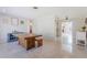 Open-concept living room showcases the dining room with a rustic wooden table and views to other living spaces at 1361 Hobson St, Longwood, FL 32750