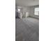 Spacious loft area with plush gray carpet at 1758 Tree Shade Dr, Davenport, FL 33837