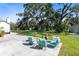 Large backyard featuring mature trees, outdoor seating, and a relaxing atmosphere at 1780 Old Mission Rd, Edgewater, FL 32132