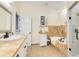 Elegant bathroom featuring a soaking tub, chandelier, and tiled vanity area at 1780 Old Mission Rd, Edgewater, FL 32132