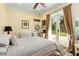 Bright bedroom with French doors leading to outdoor space and a serene view at 1780 Old Mission Rd, Edgewater, FL 32132