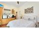 Cozy bedroom featuring a kitchenette, decorative headboard and soothing decor at 1780 Old Mission Rd, Edgewater, FL 32132