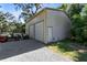 Large garage featuring two roll-up doors, providing ample storage and workspace at 1780 Old Mission Rd, Edgewater, FL 32132