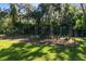 Spacious garden with multiple plots ready for planting, enclosed by a sturdy fence at 1780 Old Mission Rd, Edgewater, FL 32132