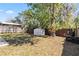 Scenic view of the backyard, complete with a storage shed and ample space at 1870 Bridgeview Cir, Orlando, FL 32824