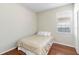 Cozy bedroom featuring hardwood floors, a comfortable bed, a bright window, and a closet at 1870 Bridgeview Cir, Orlando, FL 32824