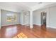 Bright living room with high ceilings, hardwood floors, and large arched window at 1870 Bridgeview Cir, Orlando, FL 32824