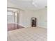 Open living room showing tile floors, a front door view, and a decorative cabinet at 1870 Bridgeview Cir, Orlando, FL 32824