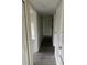 Hallway featuring modern gray wood-look tile flooring and neutral wall paint at 1926 Kingsland Ave, Orlando, FL 32808