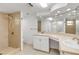 Well-lit bathroom featuring tiled shower, white vanity with dual sinks and ample counter space at 2130 Pope Ave, South Daytona, FL 32119