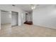 Spacious bedroom featuring tile flooring, a ceiling fan, and a mirrored closet at 2130 Pope Ave, South Daytona, FL 32119