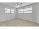 Bedroom with tile flooring, ceiling fan, and natural light from two windows at 2130 Pope Ave, South Daytona, FL 32119