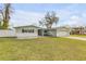 Traditional home featuring a lush front yard, a two-car garage and inviting curb appeal at 2130 Pope Ave, South Daytona, FL 32119