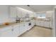 Bright kitchen with white cabinets, stainless steel appliances and a window overlooking the outdoors at 2130 Pope Ave, South Daytona, FL 32119