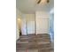 Bedroom featuring wood look flooring, a ceiling fan, and storage at 2394 Orange Center Blvd, Orlando, FL 32805