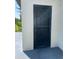 Close up of the black security door and painted block house exterior at 2394 Orange Center Blvd, Orlando, FL 32805