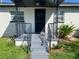 Inviting front porch with a covered entry and wrought iron railings at 2394 Orange Center Blvd, Orlando, FL 32805