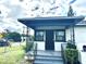 Charming front porch with black metal details at 2394 Orange Center Blvd, Orlando, FL 32805