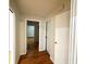 Hallway showing hardwood floors with a view into another room at 2394 Orange Center Blvd, Orlando, FL 32805