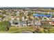 Aerial view of the neighborhood, showcasing the homes and community pond at 2417 Hybrid Dr, Kissimmee, FL 34758