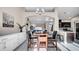 Bright dining area adjacent to kitchen, featuring modern table and sleek white cabinetry at 2417 Hybrid Dr, Kissimmee, FL 34758