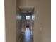 Hallway featuring tile flooring that leads to a bathroom at 2602 Talon Ct, Orlando, FL 32837