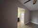 A view into a bathroom, showcasing the tile shower, creating a bright and inviting space at 2602 Talon Ct, Orlando, FL 32837