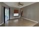 Neutral living room featuring tile flooring, a ceiling fan, and outdoor access at 2602 Talon Ct, Orlando, FL 32837