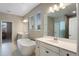 Luxurious bathroom with a freestanding tub, dual sinks, and a glass-enclosed shower at 2620 Cedar Shake Ct, Oviedo, FL 32765