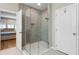 Modern bathroom featuring a frameless glass shower with tile surround and a built-in niche at 2620 Cedar Shake Ct, Oviedo, FL 32765