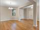 Elegant dining area featuring hardwood floors, a modern chandelier, and abundant natural light at 2620 Cedar Shake Ct, Oviedo, FL 32765