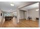 Spacious living room featuring hardwood floors, neutral paint, and ample natural light at 2620 Cedar Shake Ct, Oviedo, FL 32765