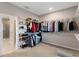 Spacious walk-in closet with ample shelving and hanging space for clothes and shoes at 2620 Cedar Shake Ct, Oviedo, FL 32765