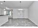 Bright dining area featuring a modern chandelier, tile flooring, and natural light at 280 Marion Oaks Golf Way, Ocala, FL 34473