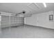 Clean garage with painted floor, door to interior, and insulated garage door at 280 Marion Oaks Golf Way, Ocala, FL 34473