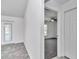 Hallway leading to living room features closet with view of exterior door to lanai at 280 Marion Oaks Golf Way, Ocala, FL 34473