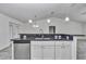 Close-up shot of kitchen island with granite countertop, sink, and modern faucet at 280 Marion Oaks Golf Way, Ocala, FL 34473