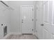 Laundry room with washer and dryer hookups and storage shelves at 2844 Sw 162Nd Street Rd, Ocala, FL 34473