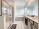 Bright and clean bathroom with a glass-enclosed shower and dual sink vanity for convenience at 2908 Protagonist St, Kissimmee, FL 34746