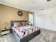 Comfortable bedroom featuring an inviting bed, modern decor, and ample closet space at 2908 Protagonist St, Kissimmee, FL 34746