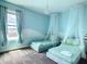 Bright bedroom showcases twin beds, sheer canopies, and a charming chandelier at 2908 Protagonist St, Kissimmee, FL 34746