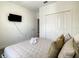 Cozy bedroom features a comfortable bed with plush pillows and a flat screen TV at 2908 Protagonist St, Kissimmee, FL 34746