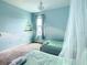 Bedroom showcases twin beds, sheer canopies, and a light blue accent wall at 2908 Protagonist St, Kissimmee, FL 34746