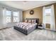 Inviting bedroom featuring an elegant bed, stylish nightstands, and bright natural light at 2908 Protagonist St, Kissimmee, FL 34746