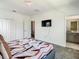 Bright bedroom with a comfortable bed, and TV for relaxing evenings at 2908 Protagonist St, Kissimmee, FL 34746