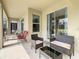 Bright laundry room has a gray washer/dryer set with a wire rack above at 2908 Protagonist St, Kissimmee, FL 34746