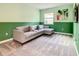 Living room features a gray sectional sofa, gray carpet, and a modern artwork at 2908 Protagonist St, Kissimmee, FL 34746