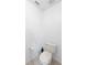 Simple white powder room with a standard toilet and light tiled floor at 2935 Willow Bay Ter, Casselberry, FL 32707